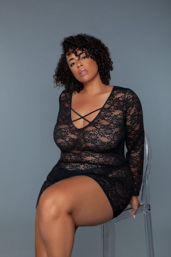 Black Sheer Chemise Dress Lace Long Sleeve 10 Black Sheer Chemise Dress Lace Long Sleeve Plus size model wearing LuckeLadybug black sheer chemise dress long sleeve lace crisscross front seated on acrylic chair