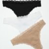 LuckeLadybug LLC women's thong underwear pack 3 lace trimmed thongs in black white and nude flat lay