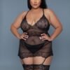 plus size black lace chemise set worn by model with sheer polka dot lace garter straps and matching thong
