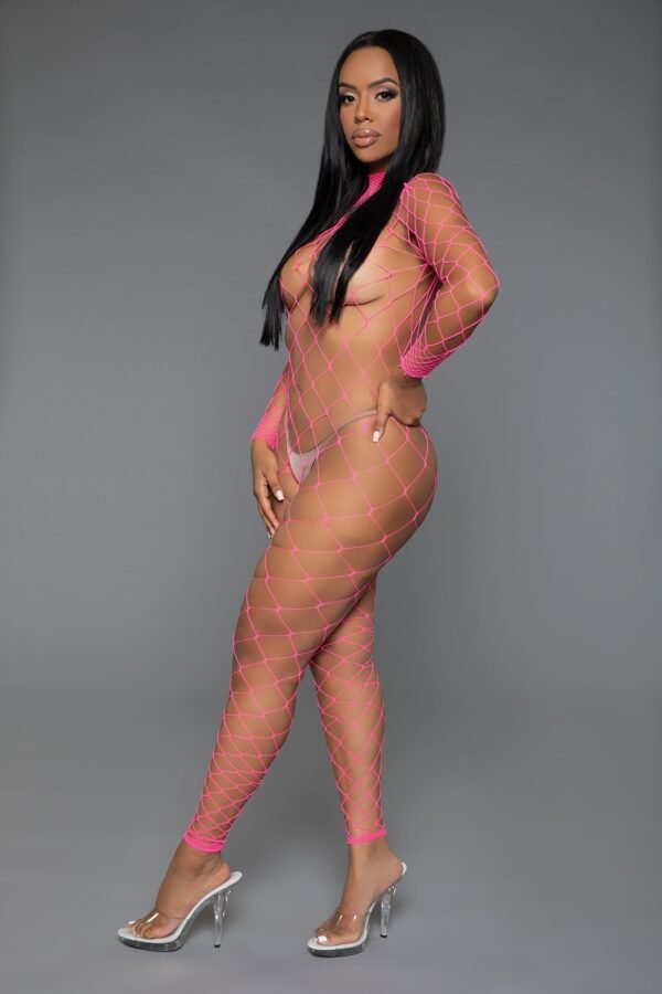 LuckeLadybug LLC model wearing a pink long sleeve mesh bodystocking with side pose and clear heels