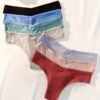 Assorted women's high-waisted hipster underwear in multiple colors arranged neatly on a soft surface