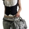 Stylish black corset vest for women paired with a white top and silver handbag