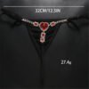 Rhinestone low rise thongs for women featuring a heart-shaped gem and elegant design
