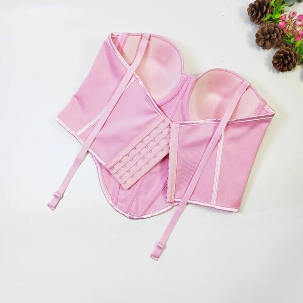 Pink corset top in a structured design, ideal for layering, featuring adjustable straps and hooks, sexy red corset top for women.