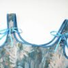 Close-up of blue floral Victorian corset top for women with ribbon straps by LuckeLadybug LLC