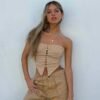 Beige women's corset crop top with a lace-up front and strapless design for a trendy look