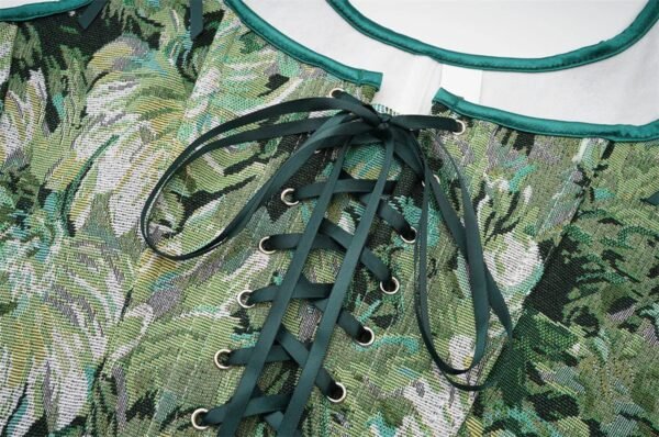 Womens Corset Top With Floral Design 16 Womens Corset Top With Floral Design Close-up of women's corset top with green floral pattern and lace-up design for stylish outfits