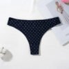 LuckeLadybug women's cotton thong panties in navy blue with white polka dots on a flat surface