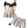 Women's satin pajama set in soft pink featuring lace trim and stylish design